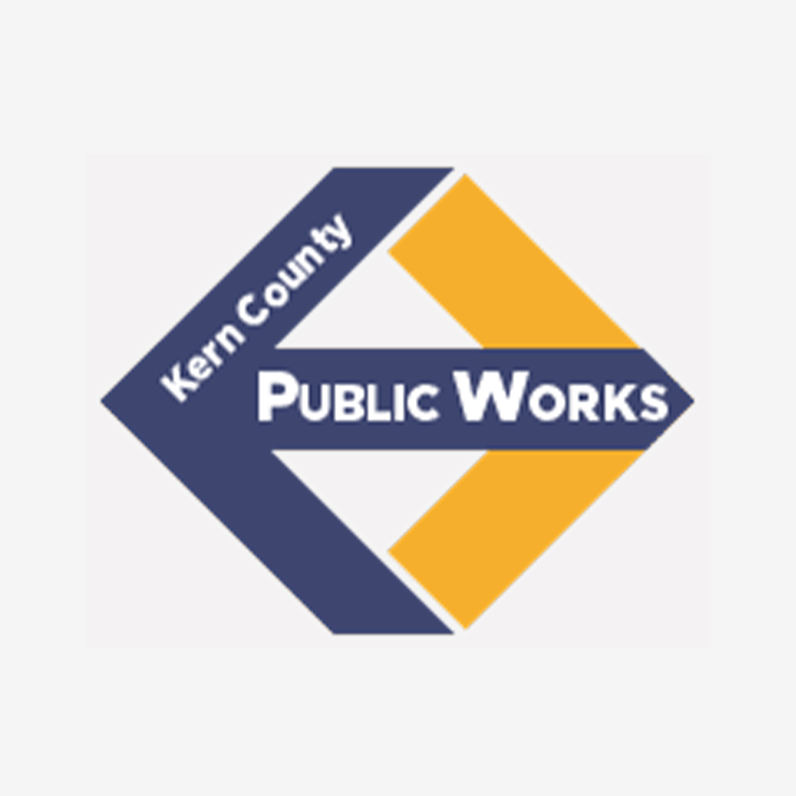 The old logo of Kern County Public Works, depicted by a diamond shape with colors that didn't match the public agency's brand